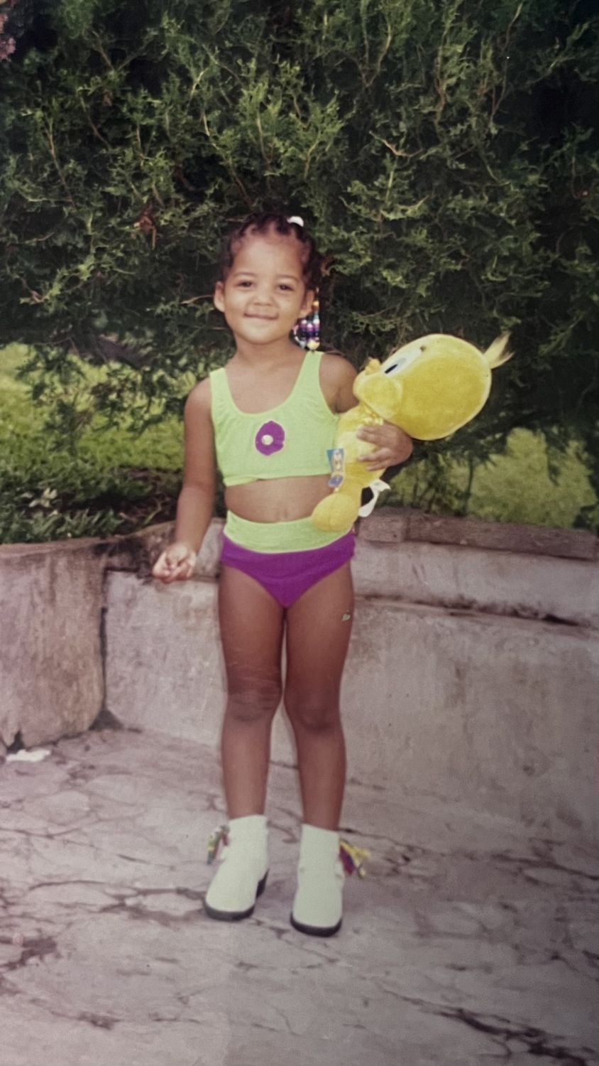 The founder as a child in a swimsuit